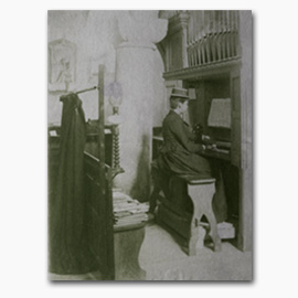 Photograph of Evelyn Eliot playing the organ at St. Germans Church, Port Eliot Collection